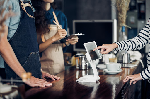 Customer using Square Inventory in a coffeeshop