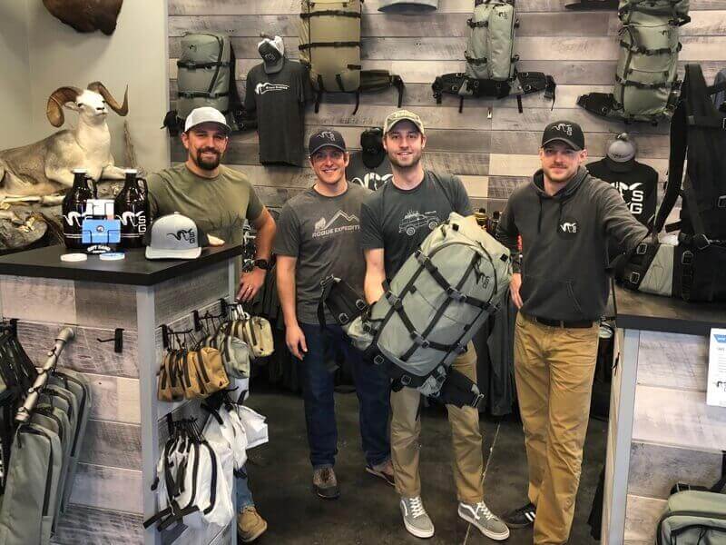 Men with a backpack in a warehouse