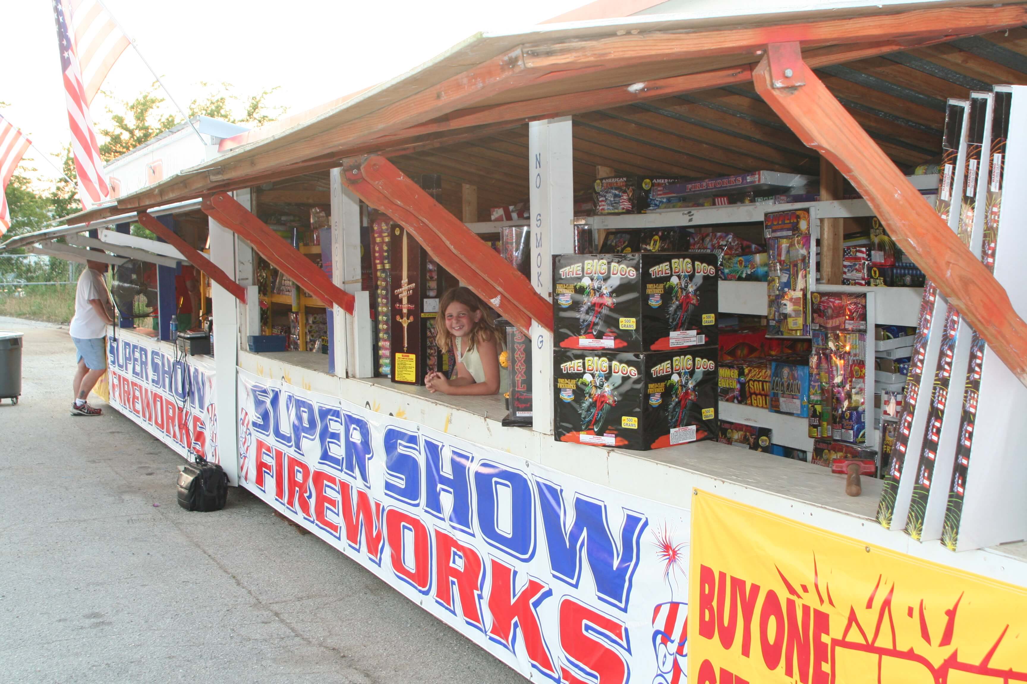 Girl at fireworks stand