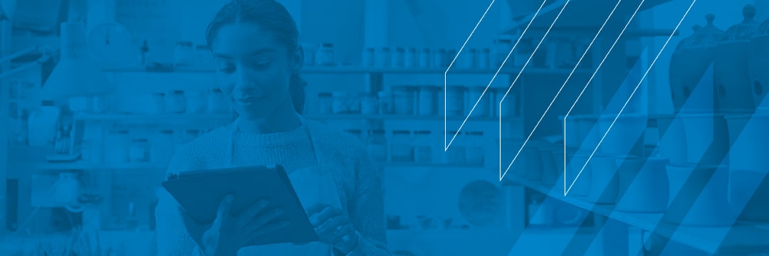 5-reasons-small-businesses-inventory-management Small business owner reviewing inventory management system