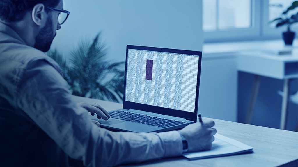 Man typing in excel functions for inventory management
