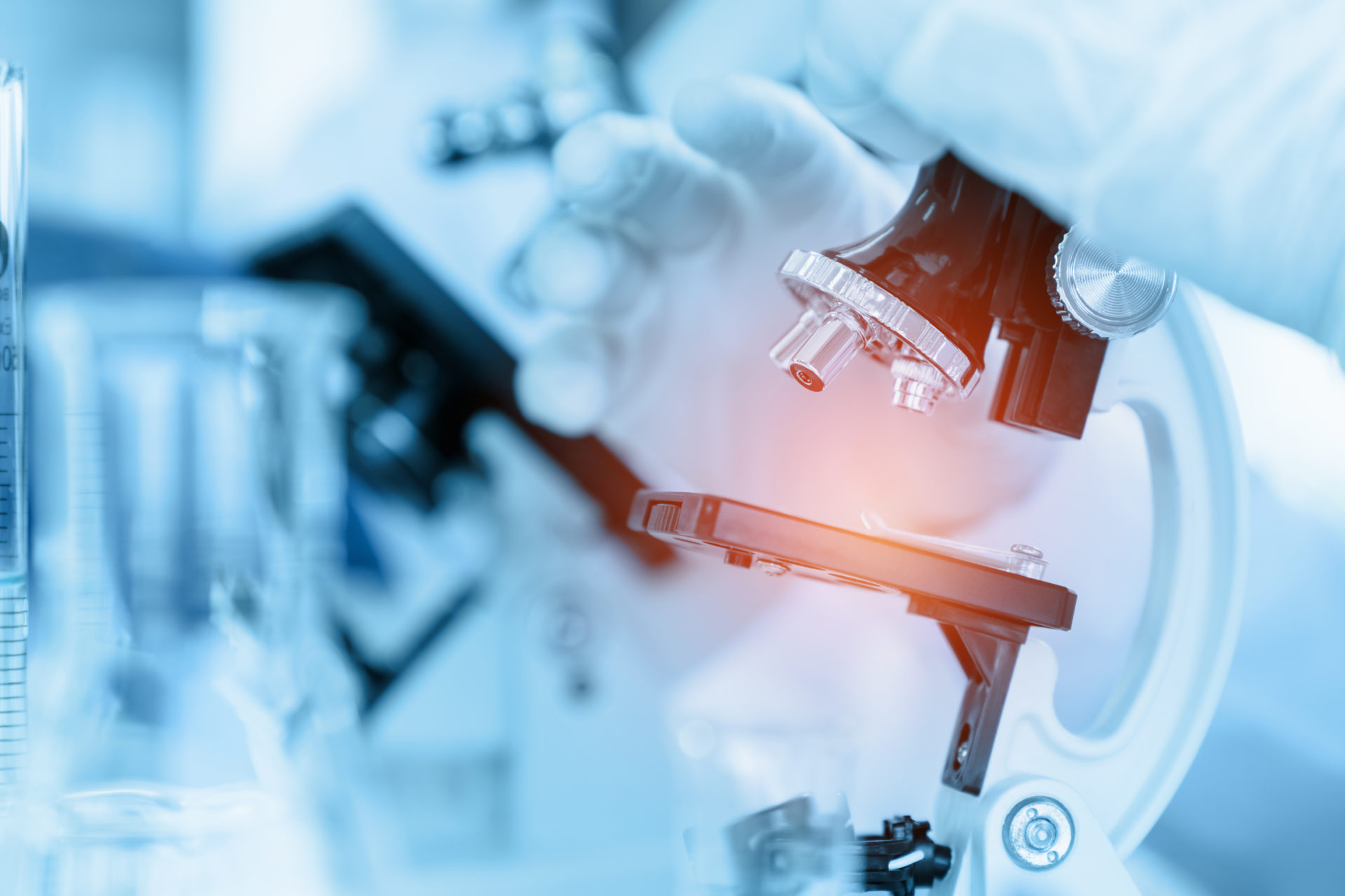 Close Up Scientist using microscope in laboratory room while mak Close Up Scientist using microscope in laboratory room while making medical testing and research